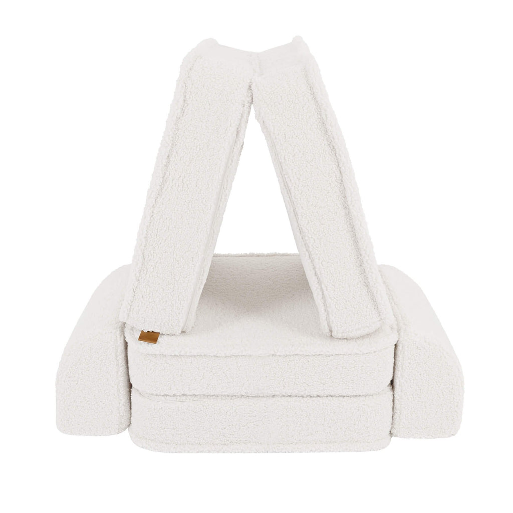 2. Small modular children's sofa in bearly cream color arranged in a tent-like structure on a white background