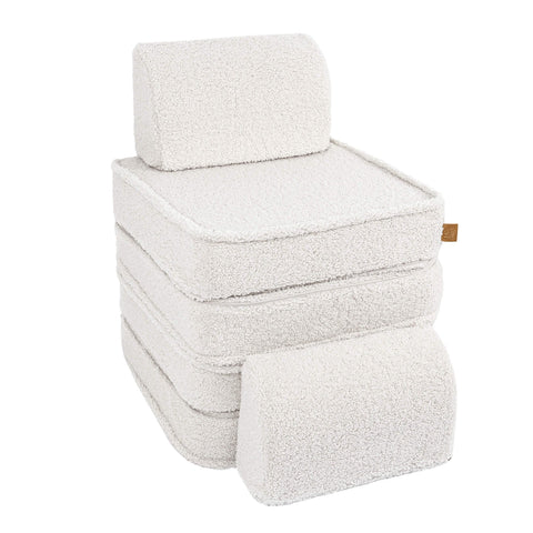 3. Small modular children's sofa in bearly cream color stacked to form a high chair with a separate cushion on a white background