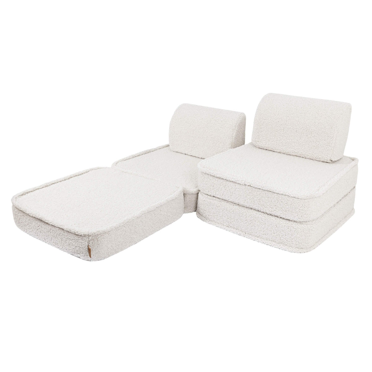 4. Small modular children's sofa in bearly cream color arranged in an L-shape with two back cushions on a white background