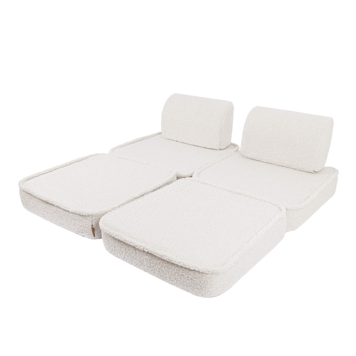 4. Small modular children's sofa in bearly cream color arranged flat with two back cushions on a white background