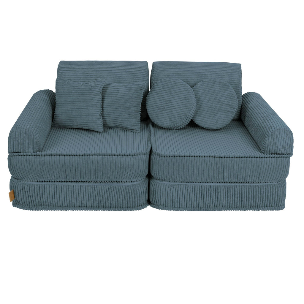 1. Medium modular children's sofa in aesthetic turquoise with ribbed texture, featuring two back cushions and two round pillows, shown in a studio setting
