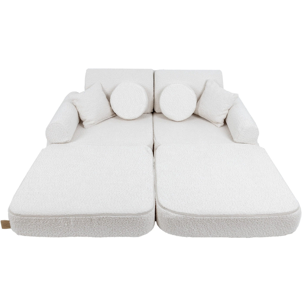 2. Medium modular children's sofa in white boucle fabric with extended seating and multiple cushions, shown in a studio setting
