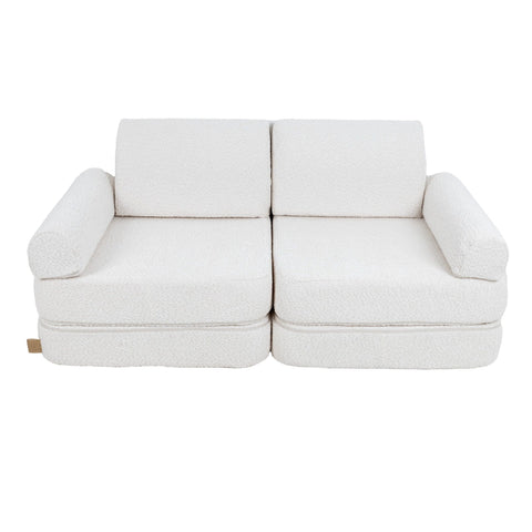 2. Medium modular children's sofa in white boucle fabric without cushions, shown in a studio setting