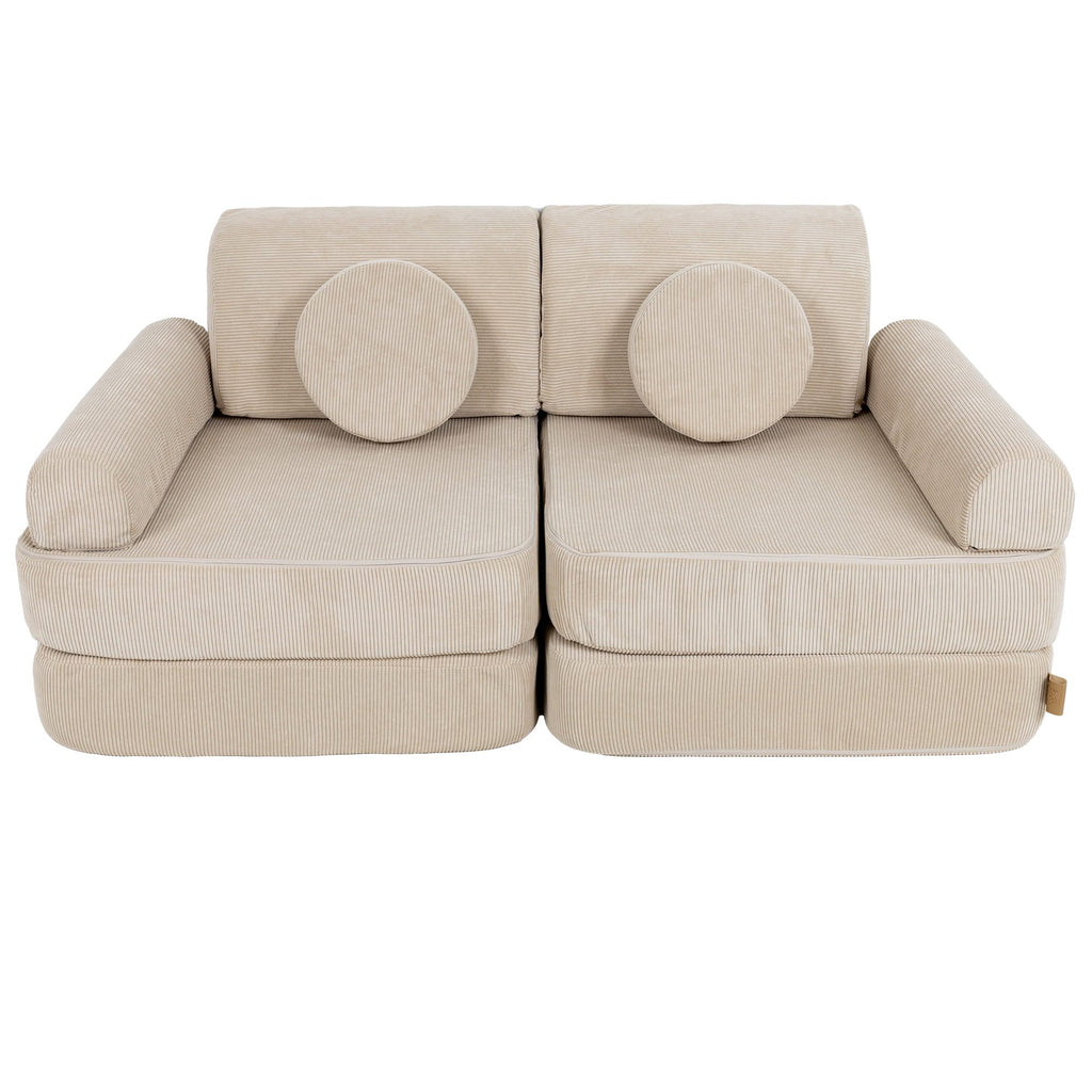 2. Medium modular children's sofa in ecru slimcord fabric with two round cushions, shown in a compact configuration