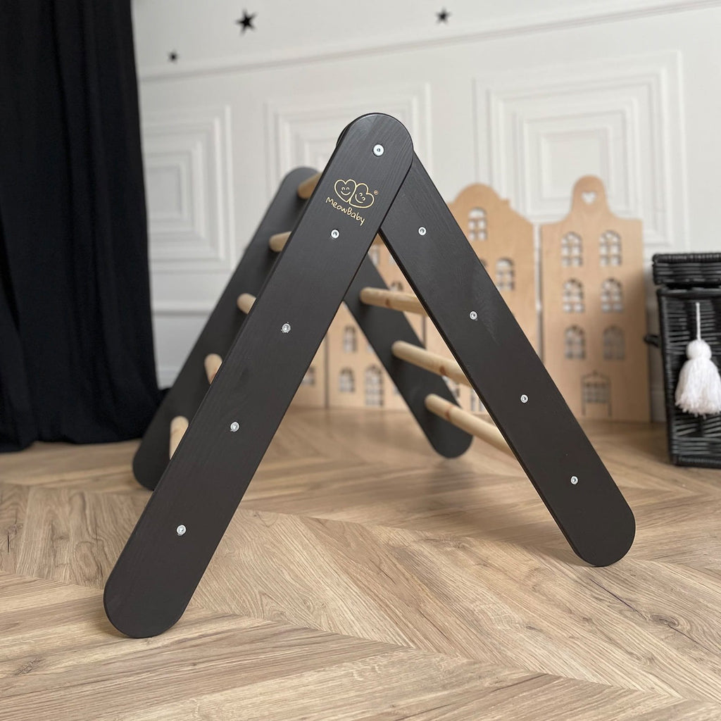 9. Black ladder house in playroom setting with decorative elements