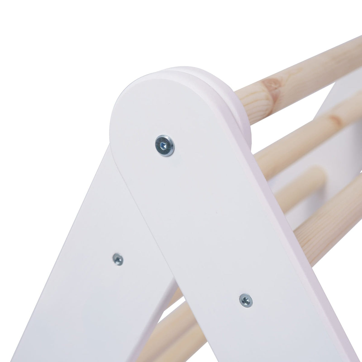 10. Close-up of the joint detail on white wooden Pikler climbing ladder with natural wood rungs