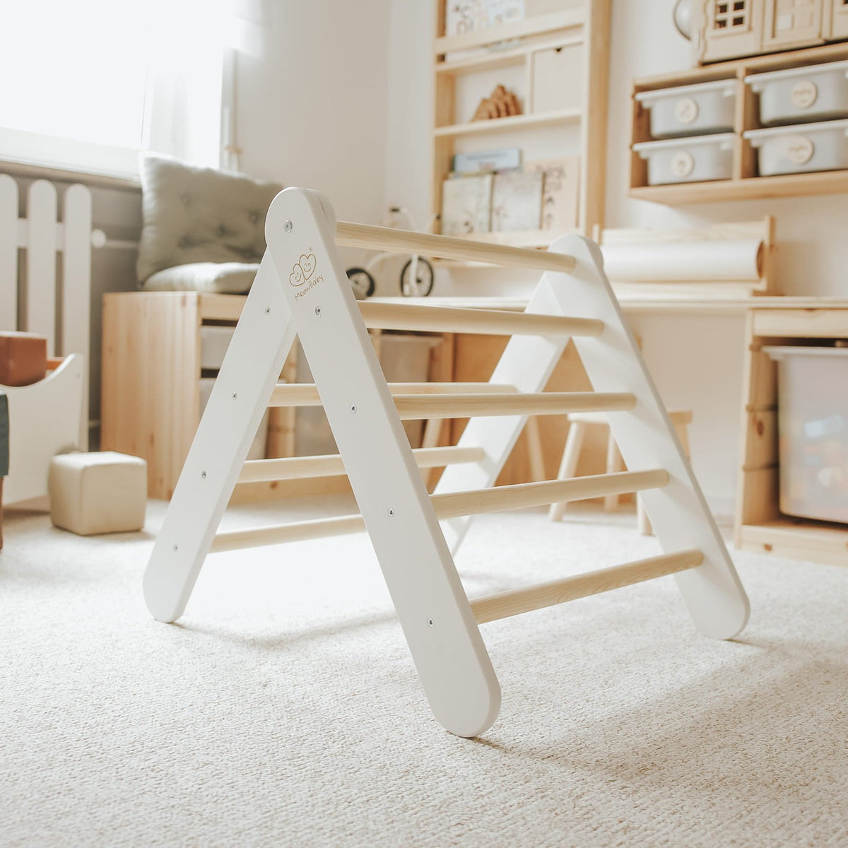 14. White ladder house in a well-lit children's playroom with storage shelves