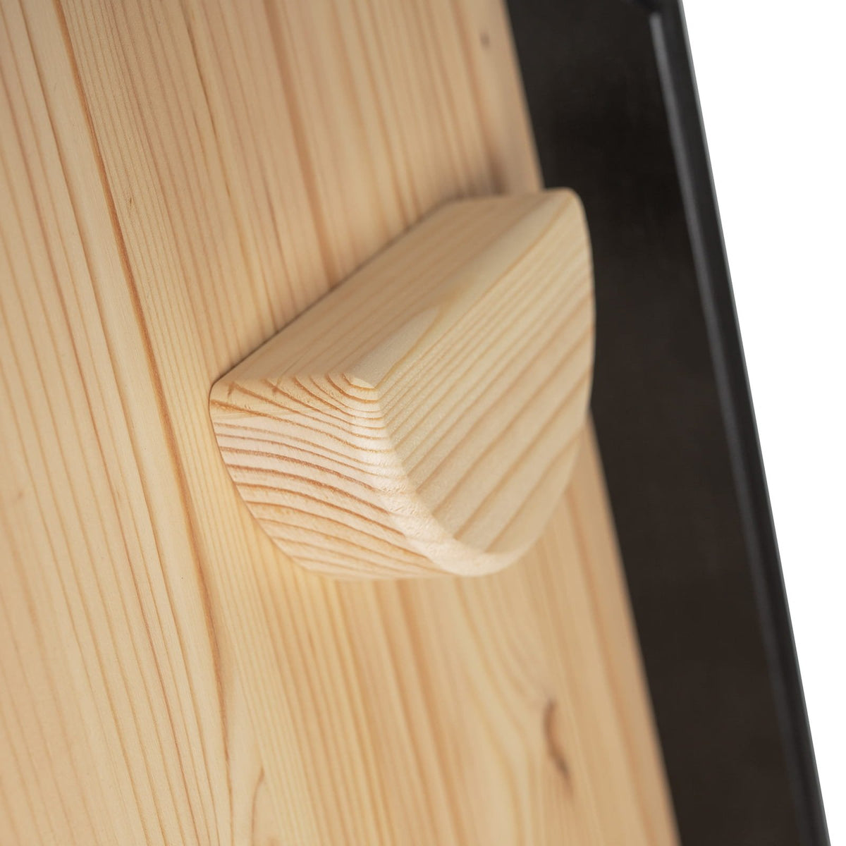 5. Close-up of wooden grip hold on climbing wall board, highlighting texture and construction
