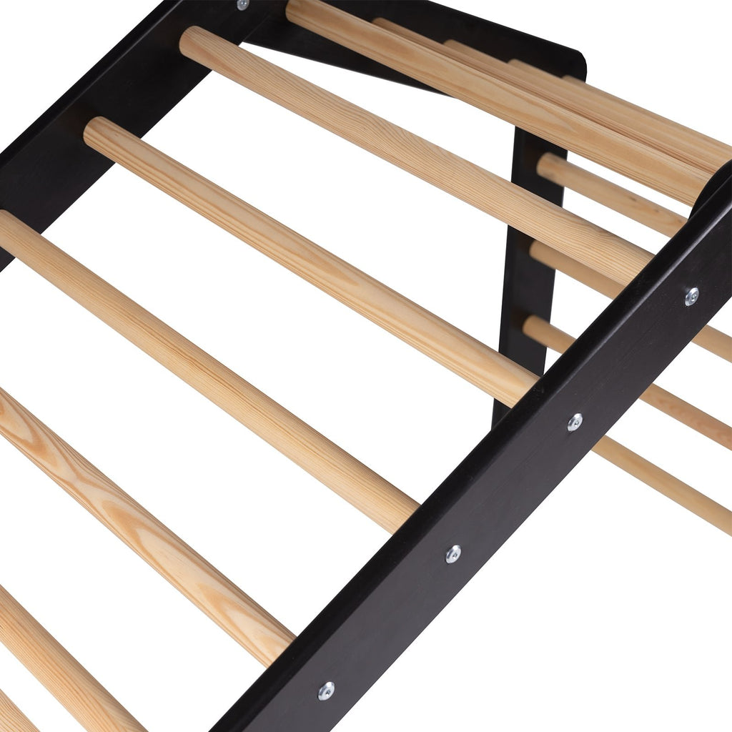 5. Close-up of black ladder house frame with natural wood rungs, highlighting construction details