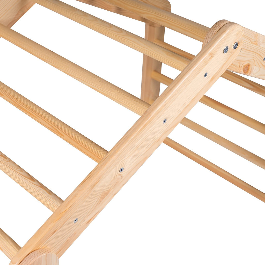 3. Close-up of natural wood ladder house frame, highlighting wood grain and construction details.