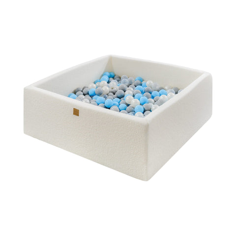 1. MeowBaby white boucle square ball pit filled with grey, blue, and white balls, shown in a studio setting highlighting soft foam construction and modern design