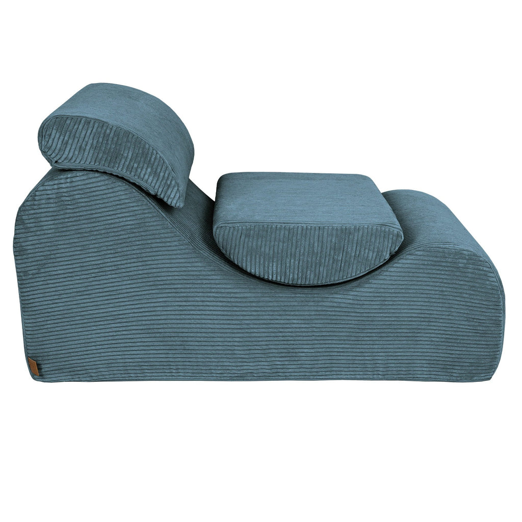 7. Side view of turquoise wave lounger with ribbed texture and removable headrest