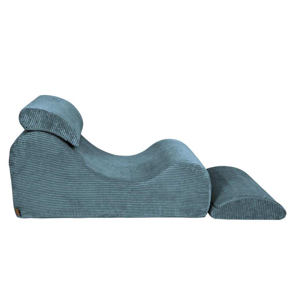 6. Side view of turquoise wave lounger with extended footrest, emphasizing ergonomic design