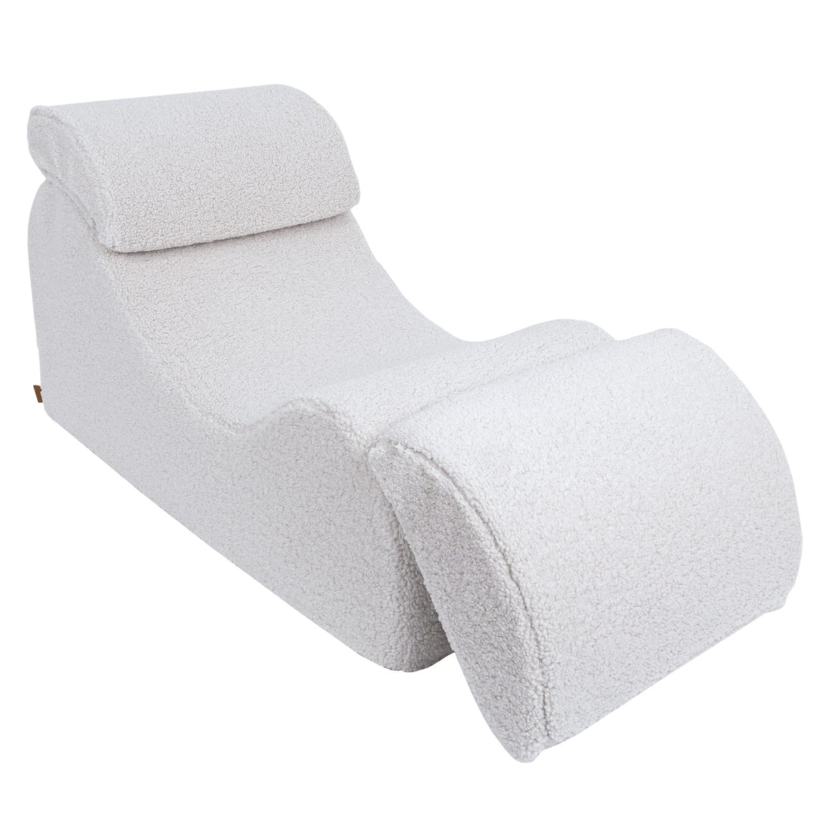 3. White Wave Lounger with footrest partially extended, showcasing its versatility in a studio setting