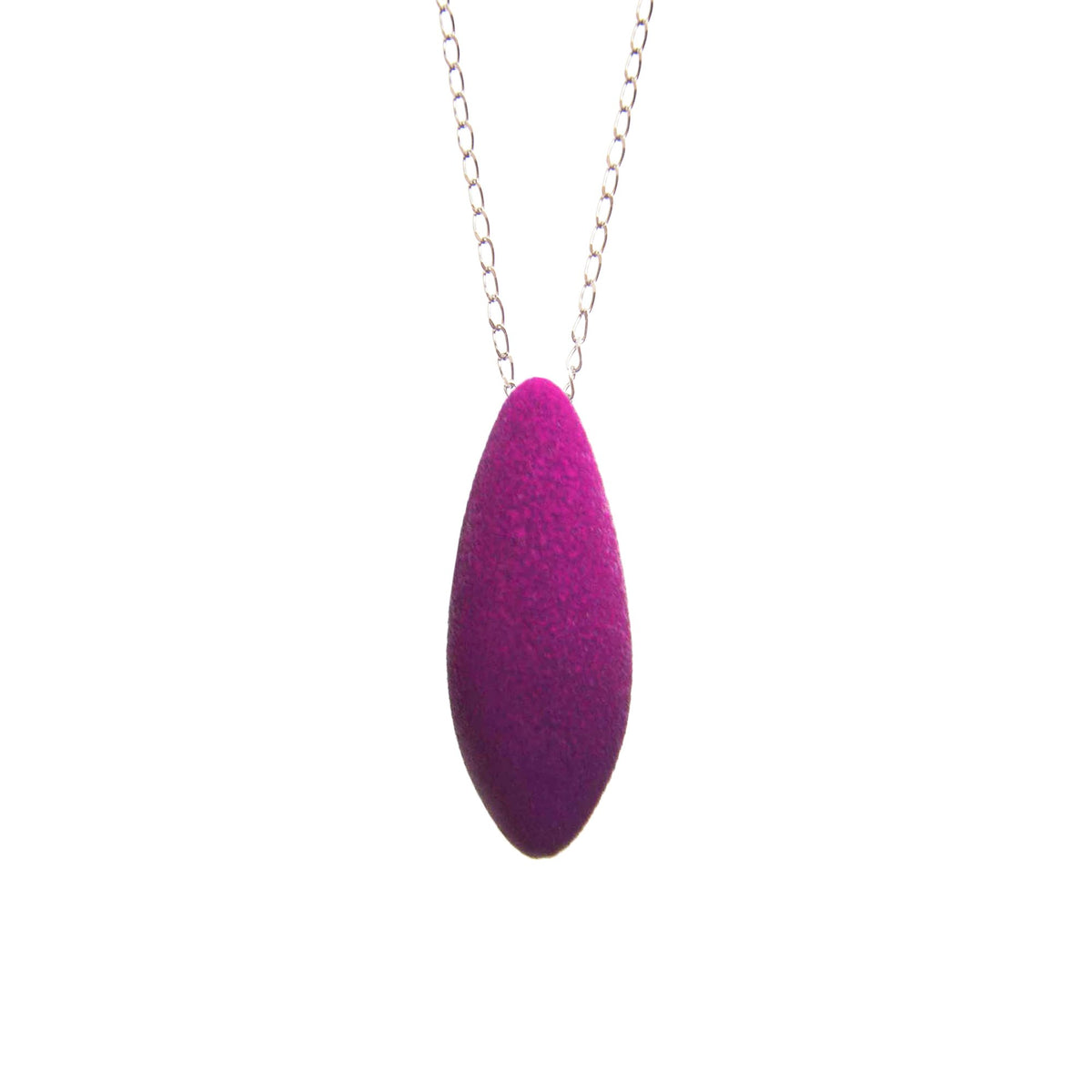 2. Tanel Veenre Mini Plum Pendant with purple velvety coating on silver chain, shown in studio setting highlighting its unique cosmic dust texture