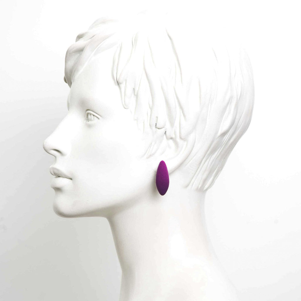 1. Profile view of mannequin wearing a single purple Mini Plums earring by Tanel Veenre against a white background