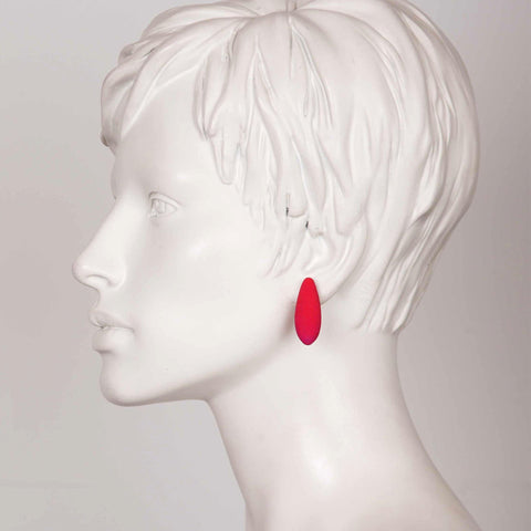 1. Side profile of mannequin wearing Tanel Veenre Mini Raspberries Earring in red, showcasing size and fit