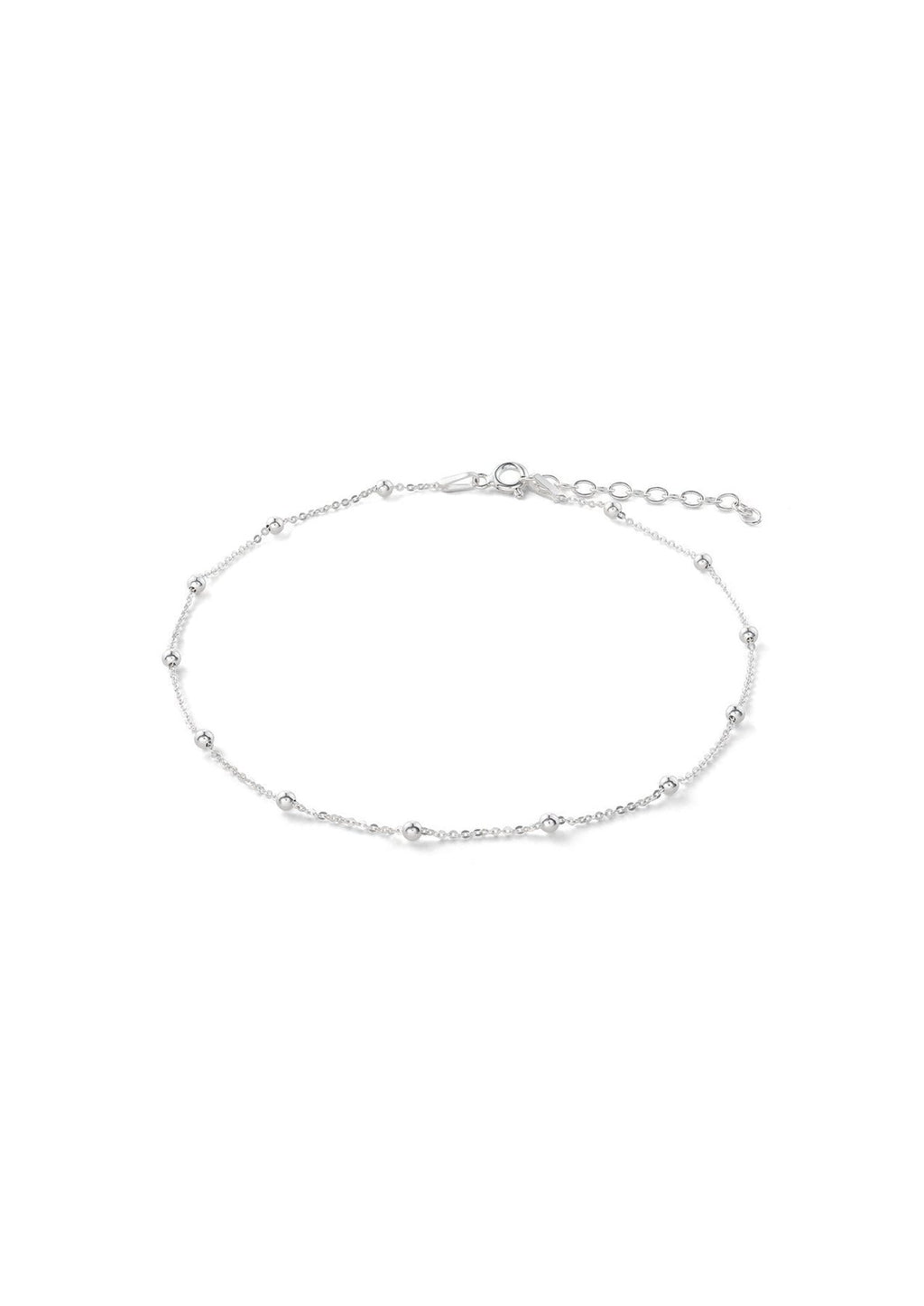 3. Studio image of NO MORE Mini Bubble Anklet in sterling silver, showing adjustable chain and minimalist design
