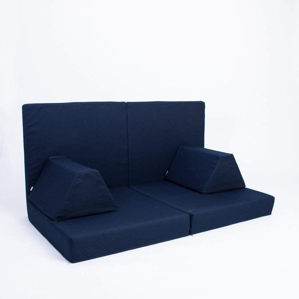 2. Navy blue play mattress set arranged with backrest and trapezoidal pillows on a white background