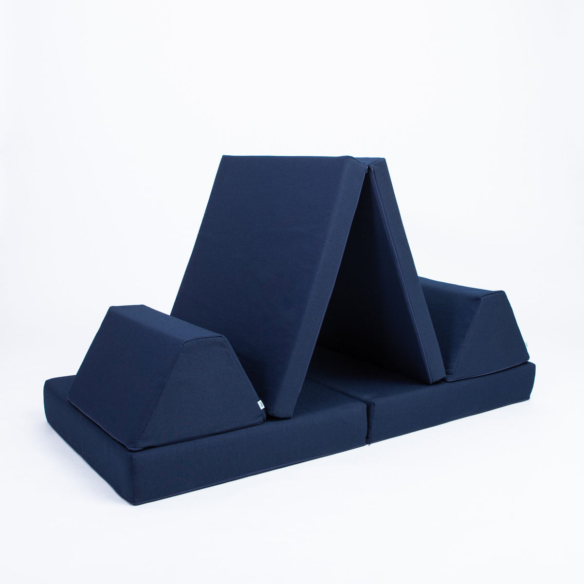 2. Navy blue play mattress set configured as a tent with trapezoidal pillows on a white background
