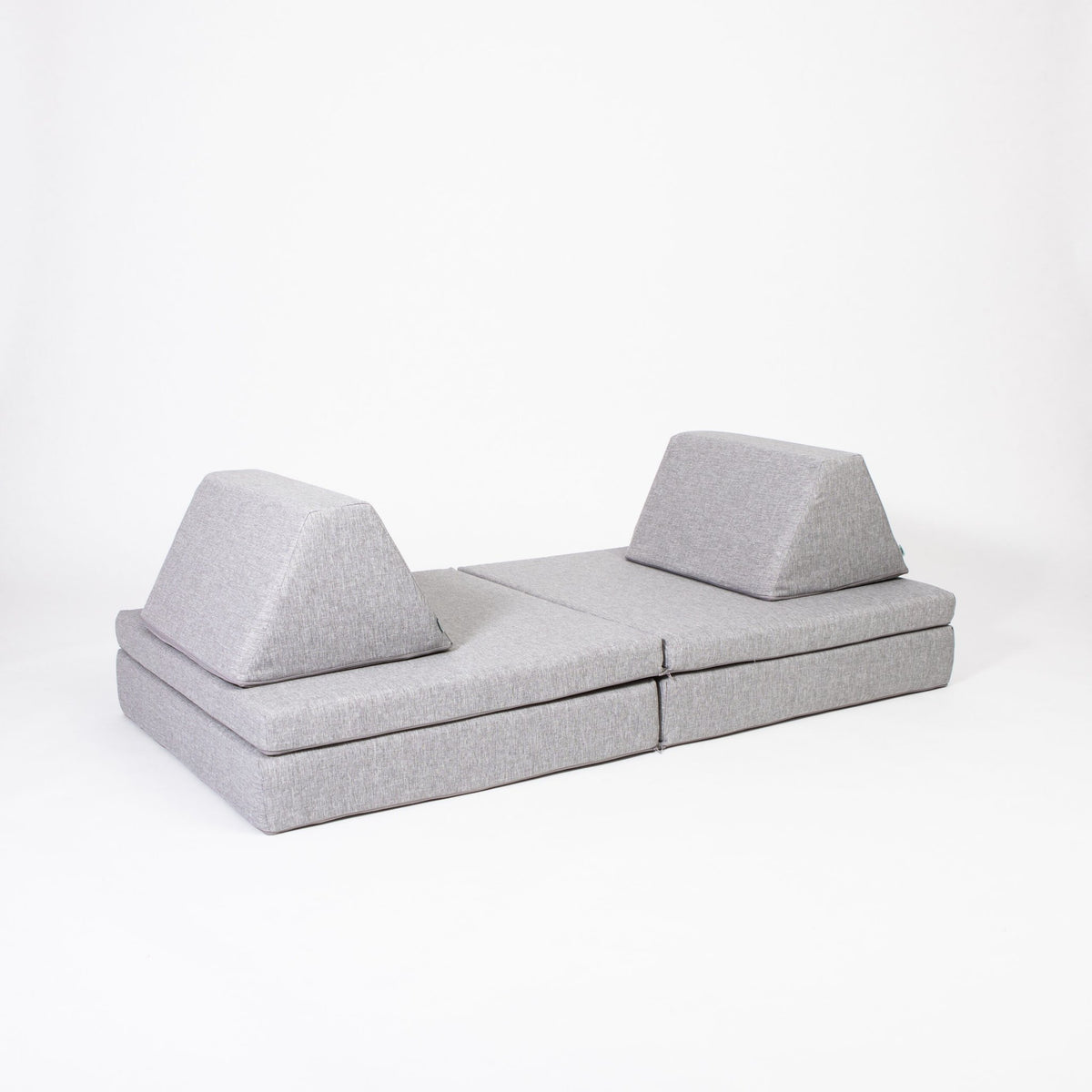 2. Grey Monboxy activity play mattress set with two trapezoidal pillows on white background