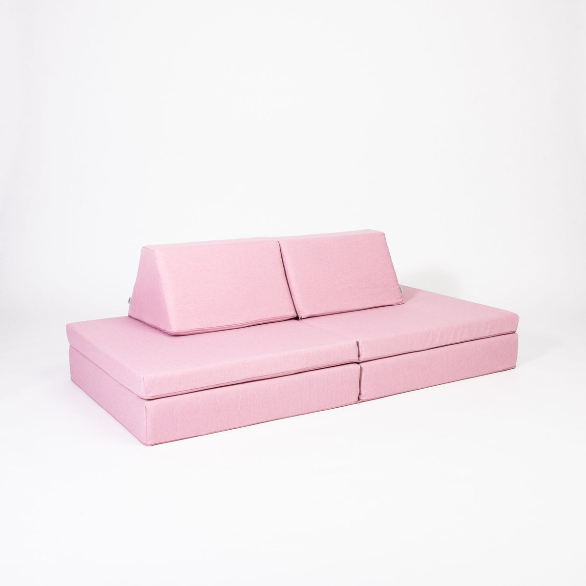 2. Pink play mattress set with pillows arranged as a sofa on a white background