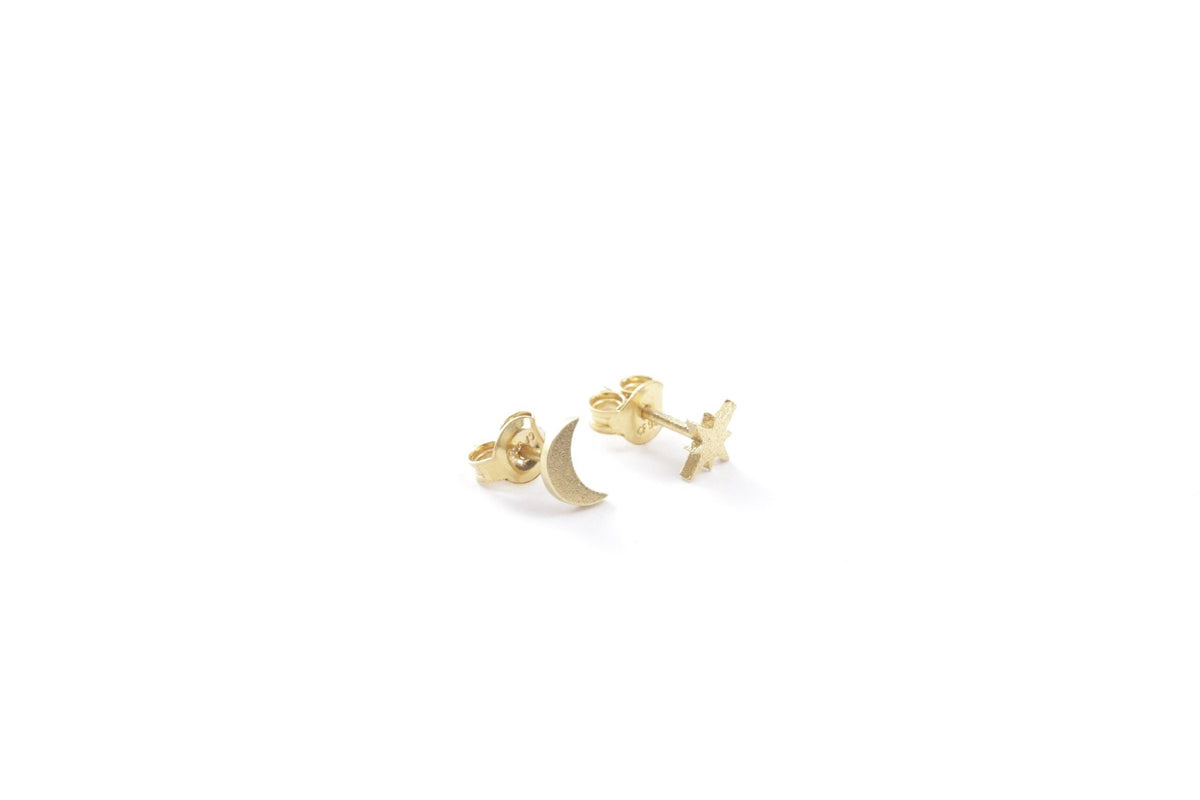2. Close-up of New Vintage by Kriss moon and star stud earrings in gold plated silver