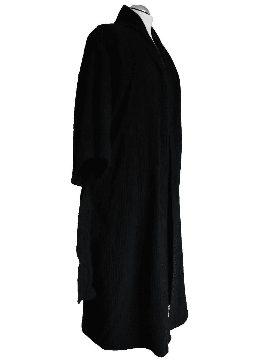 6. Back view of black ÜRP robe worn by model, emphasizing relaxed fit