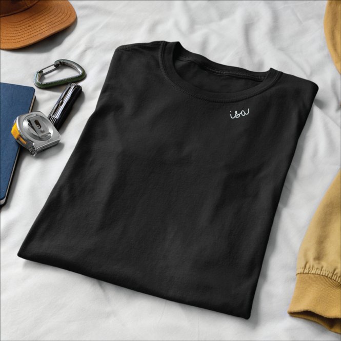 11. Flat lay of black organic cotton T-shirt by Beebila with embroidered collar, styled with accessories