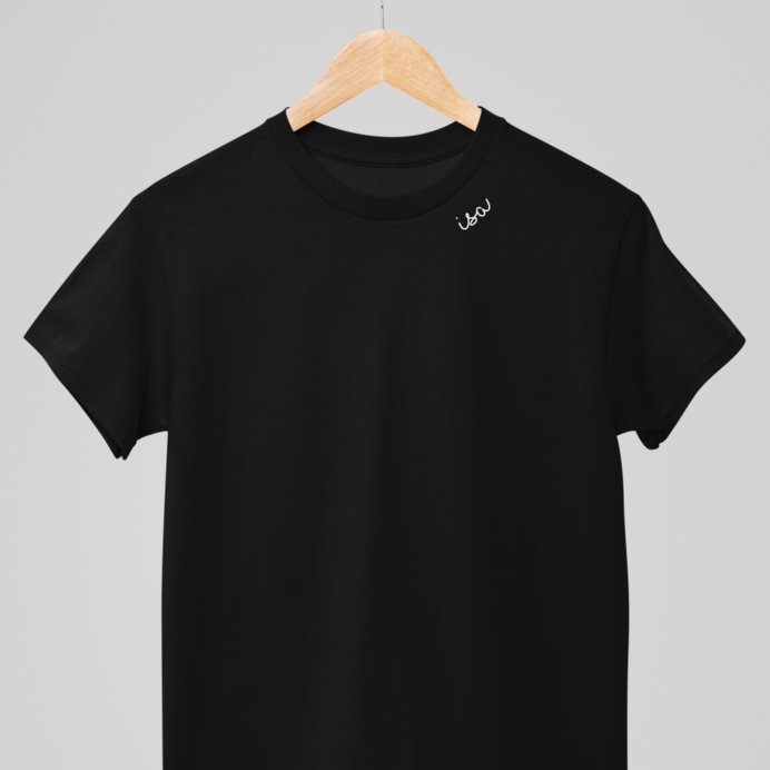 7. Studio shot of black organic cotton T-shirt by Beebila on hanger, highlighting embroidered collar
