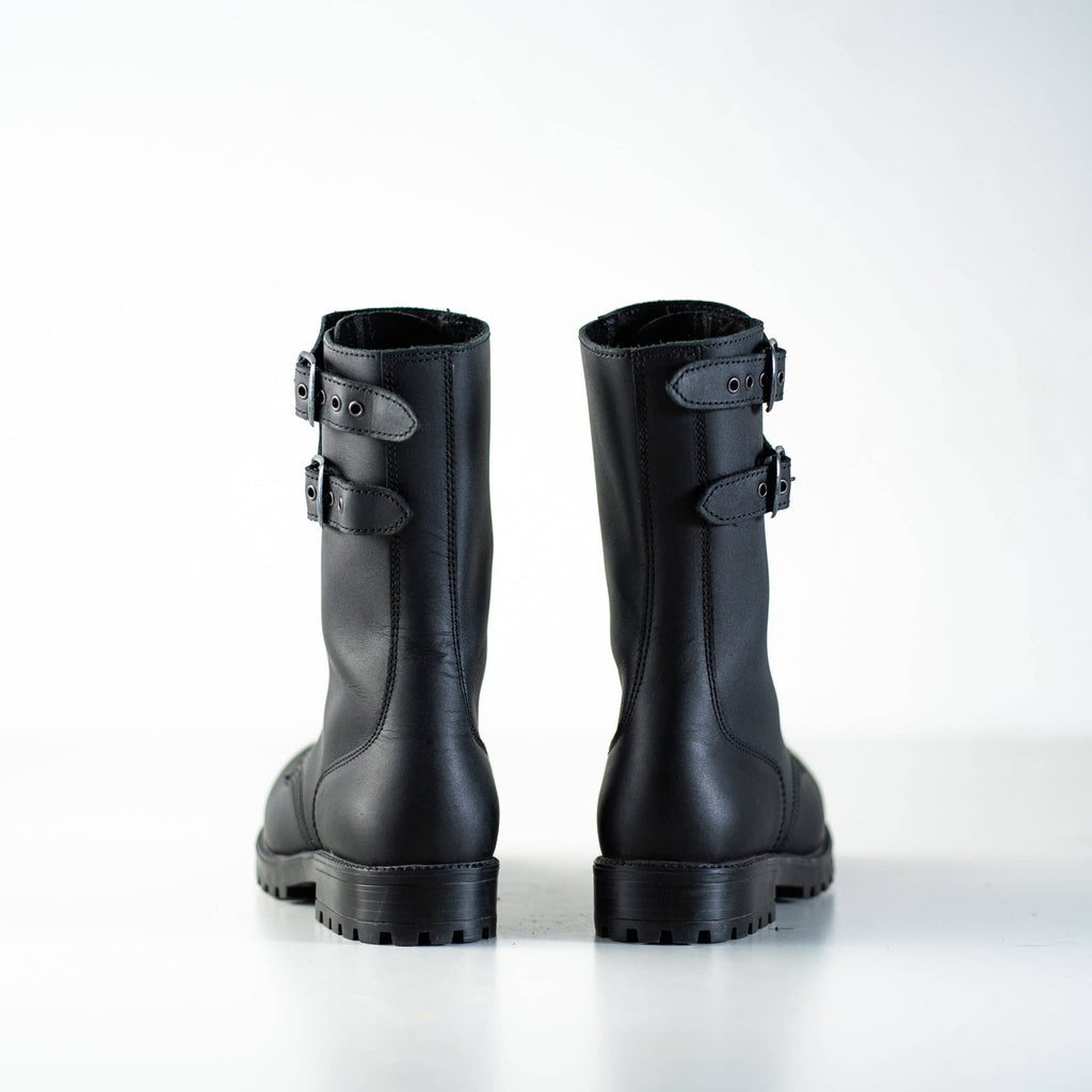 5. Back view of unisex black Tarkovsky boots by Samelin in studio, highlighting dual buckle design