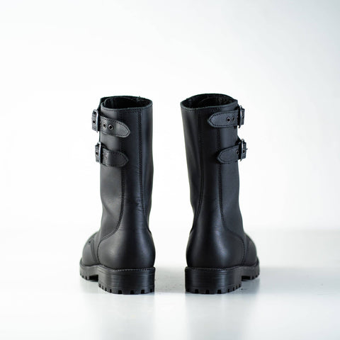 5. Back view of unisex black Tarkovsky boots by Samelin in studio, highlighting dual buckle design