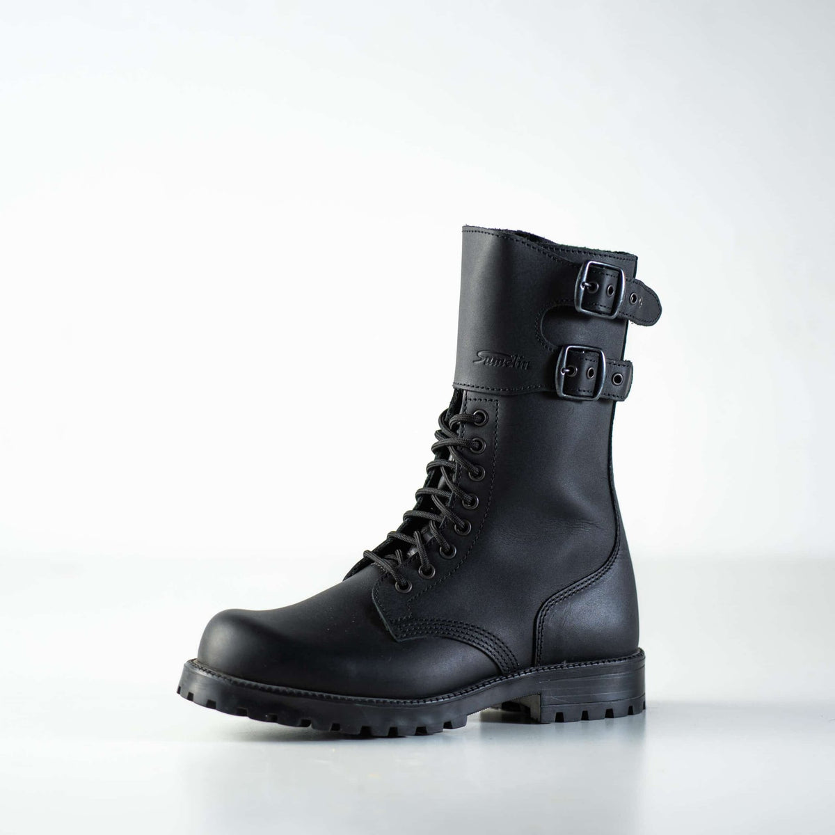 7. Unisex black Tarkovsky boots by Samelin in studio, side view highlighting lace-up and dual buckle design