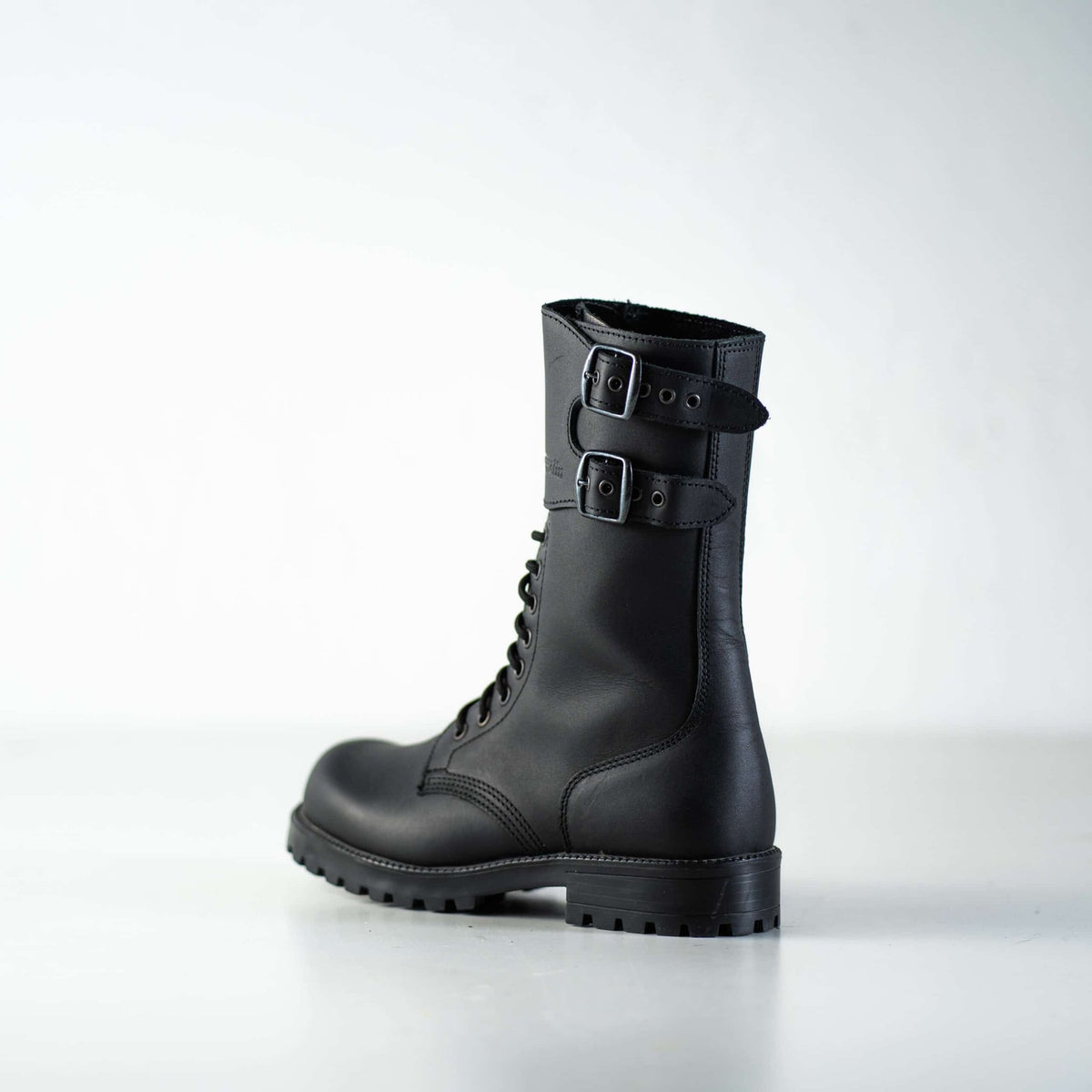4. Studio shot of unisex black Tarkovsky boots by Samelin, side view showing lace-up and buckle details