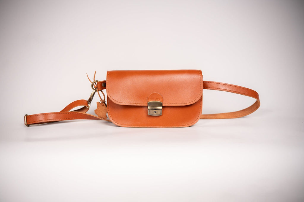 6. Studio shot of Zelma Kraft natural leather saddle bag mini in light brown, highlighting compact design