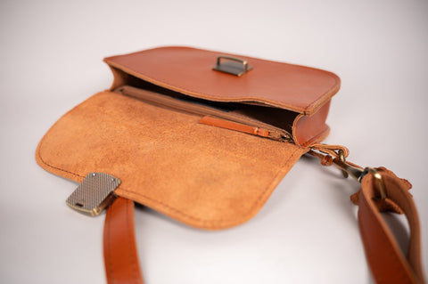 4. Close-up of interior of Zelma Kraft leather saddle bag mini showing compartments