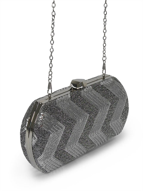 2. Side view of Nabo Evening Bag NK 2231 in silver, featuring sequin fabric and chain strap, studio setting