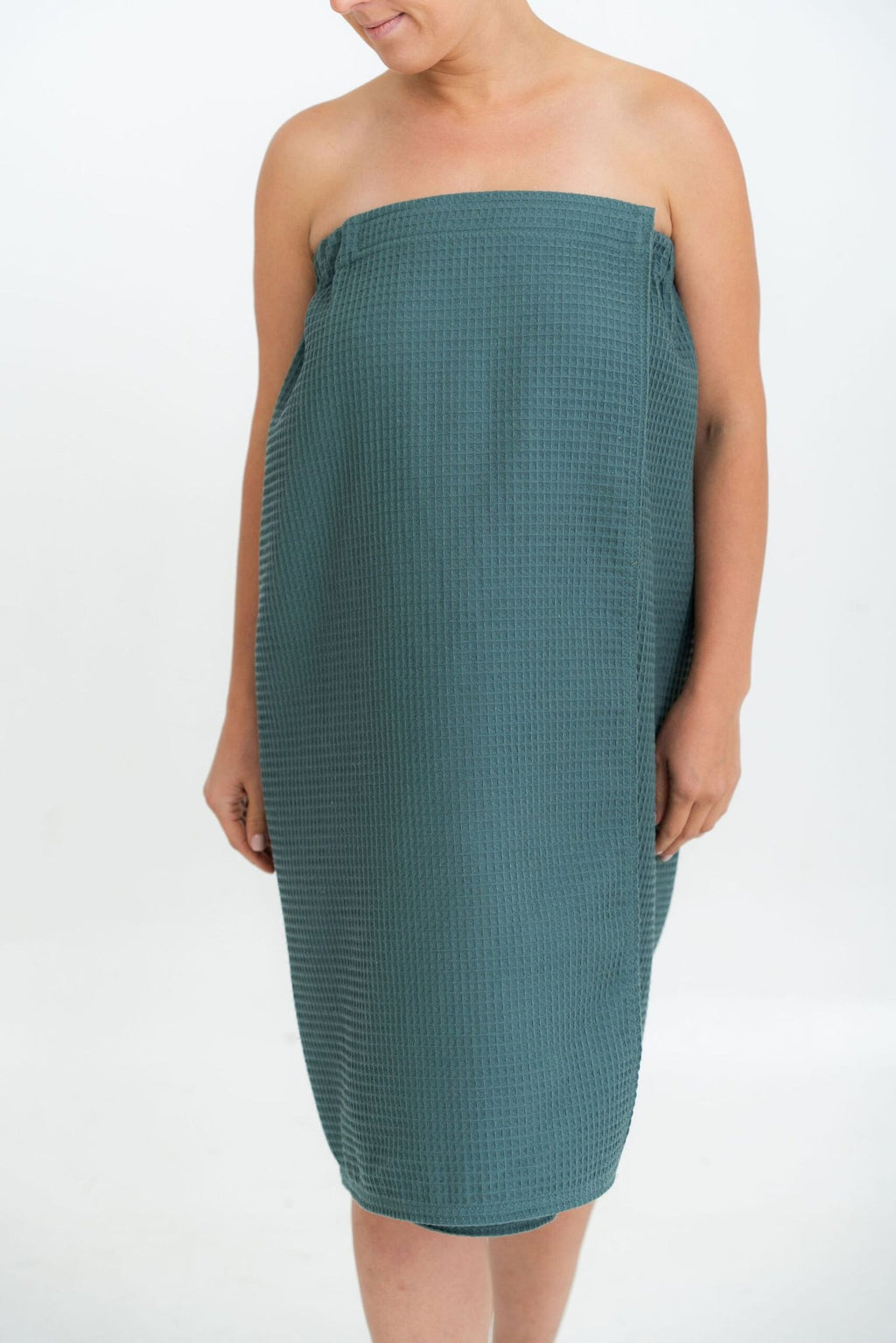 2. Woman in petrol-colored spa wrap towel, shown from front, on white background