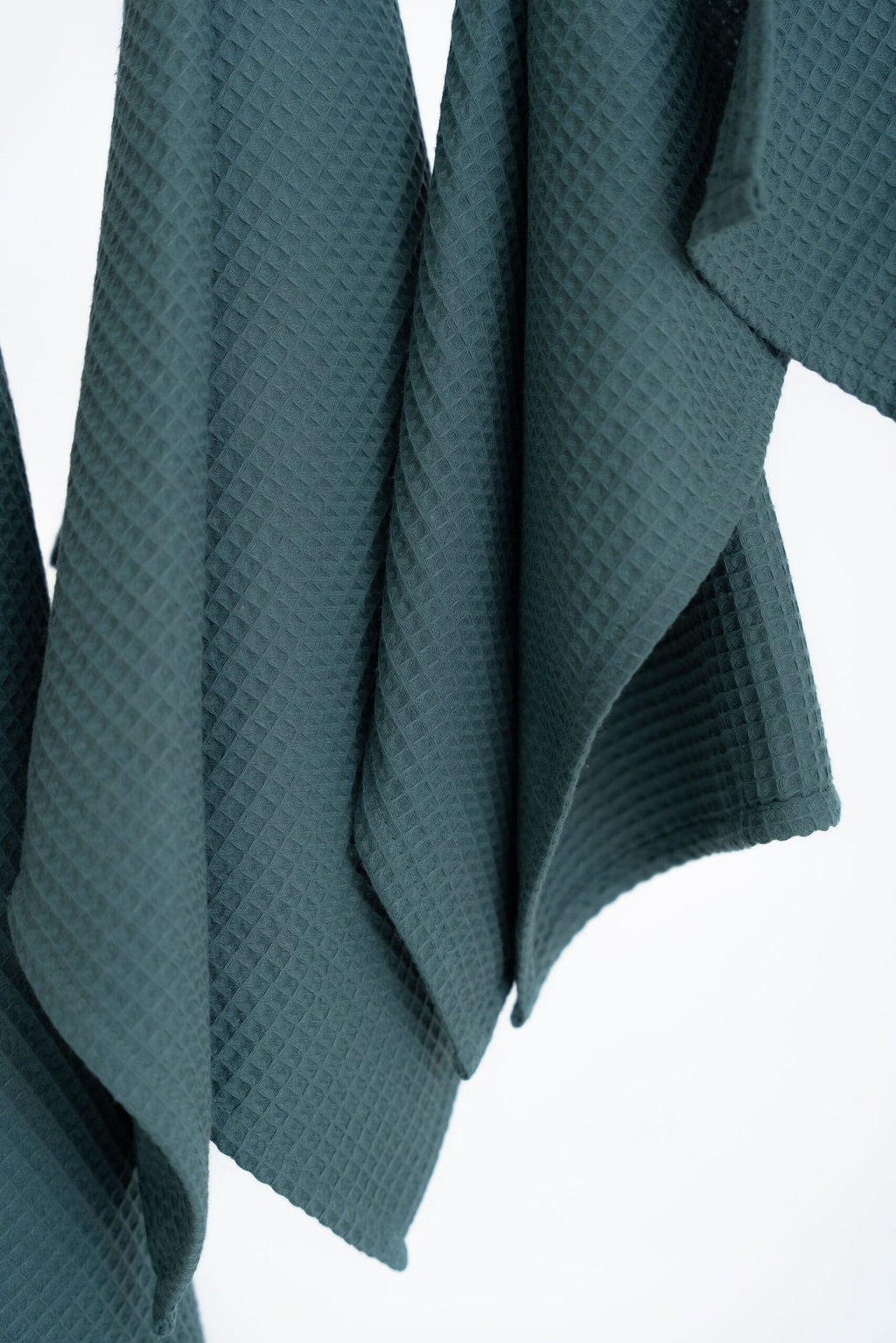 3. Close-up of petrol organic waffle cotton towels showing texture and weave