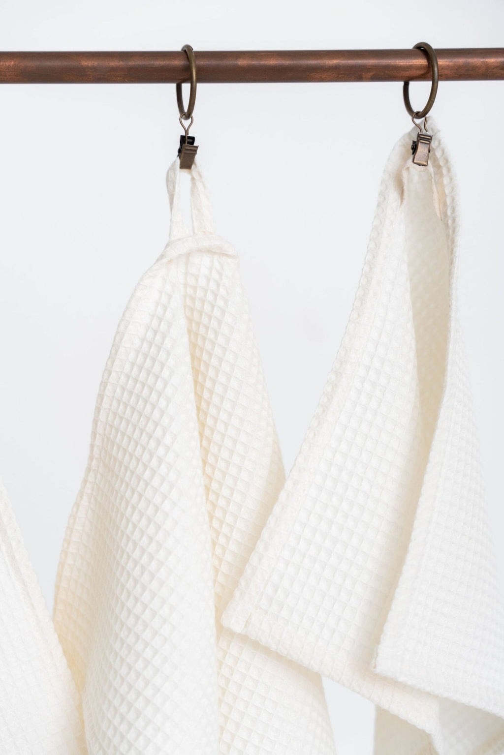 3. Close-up of hanging loops on cream waffle cotton towels emphasizing texture and design