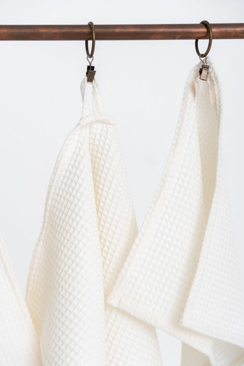 3. Close-up of hanging loops on cream waffle cotton towels emphasizing texture and design