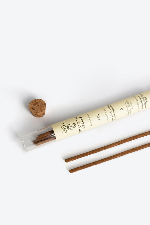 2. Smells Like Spells Natural Incense EIR in a glass tube with cork, featuring detailed label, shown in a flat lay