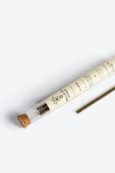 2. Close-up of Smells Like Spells Natural Incense NORNS for men, highlighting packaging and incense stick