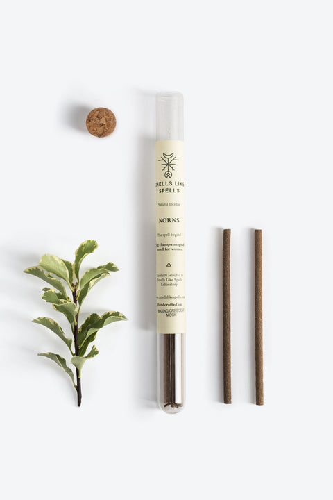 2. Smells Like Spells Natural Incense NORNS with plant element, featuring two incense sticks and cork stopper, displayed in studio