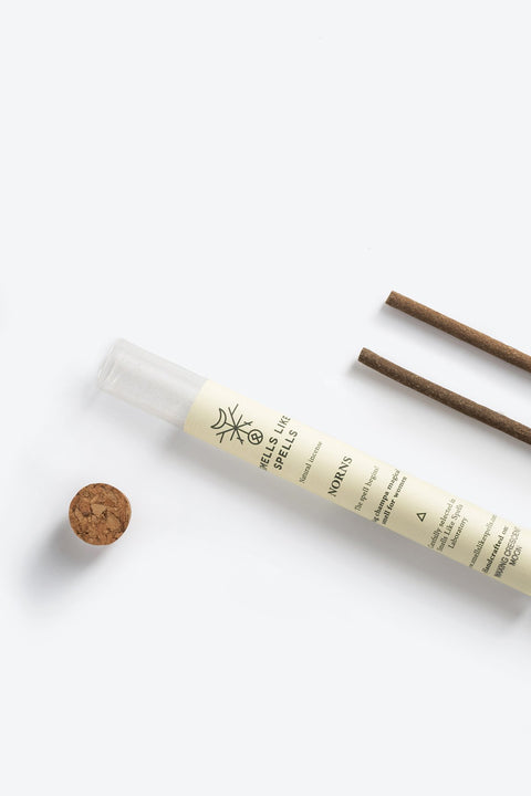 1. Smells Like Spells Natural Incense NORNS in recyclable packaging with two incense sticks, shown in a minimalist studio setting