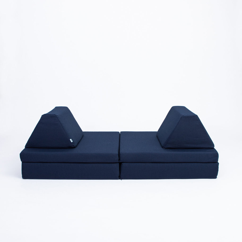 2. Navy blue play mattress set with two trapezoidal pillows on a white background