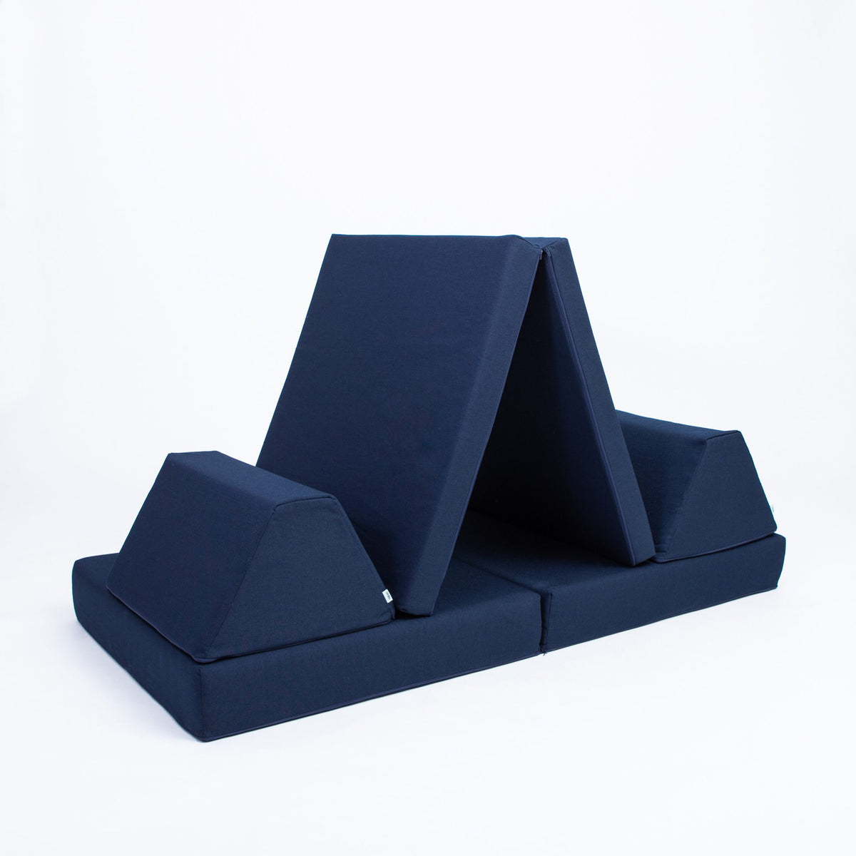 2. Navy blue play mattress set configured as a tent with trapezoidal pillows on a white background