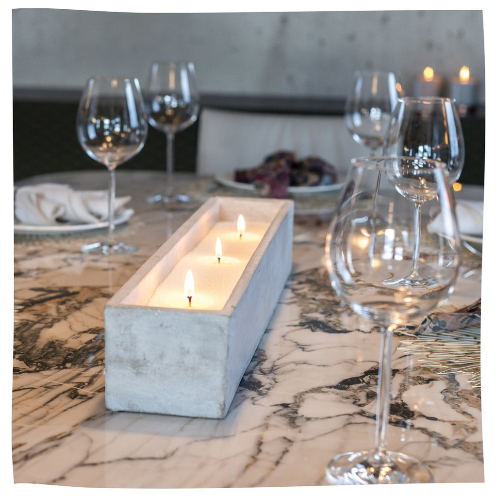 6. Woman pouring Candledust Diamond Dust powder into a decorative bowl, creating a personalized candle