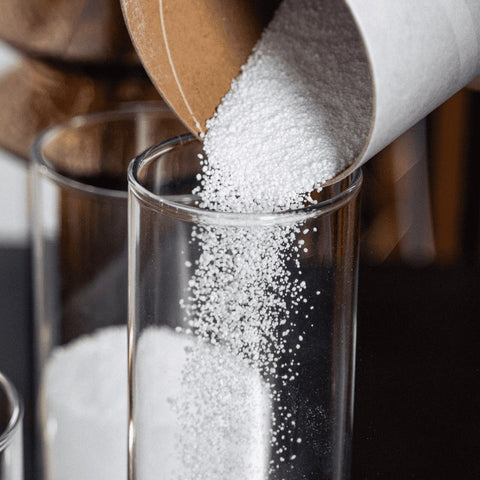 3. Close-up of Candledust powdered candle being poured into a glass container, showcasing eco-friendly vegetable wax