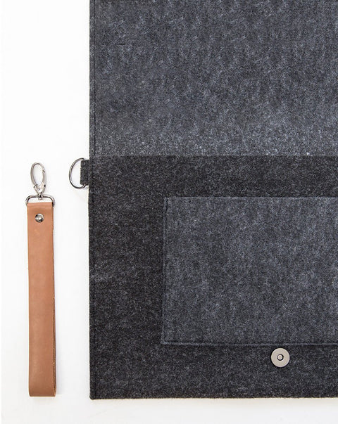 5. Close-up of Nordhale Berg black laptop bag with magnetic snap closure and removable wristband